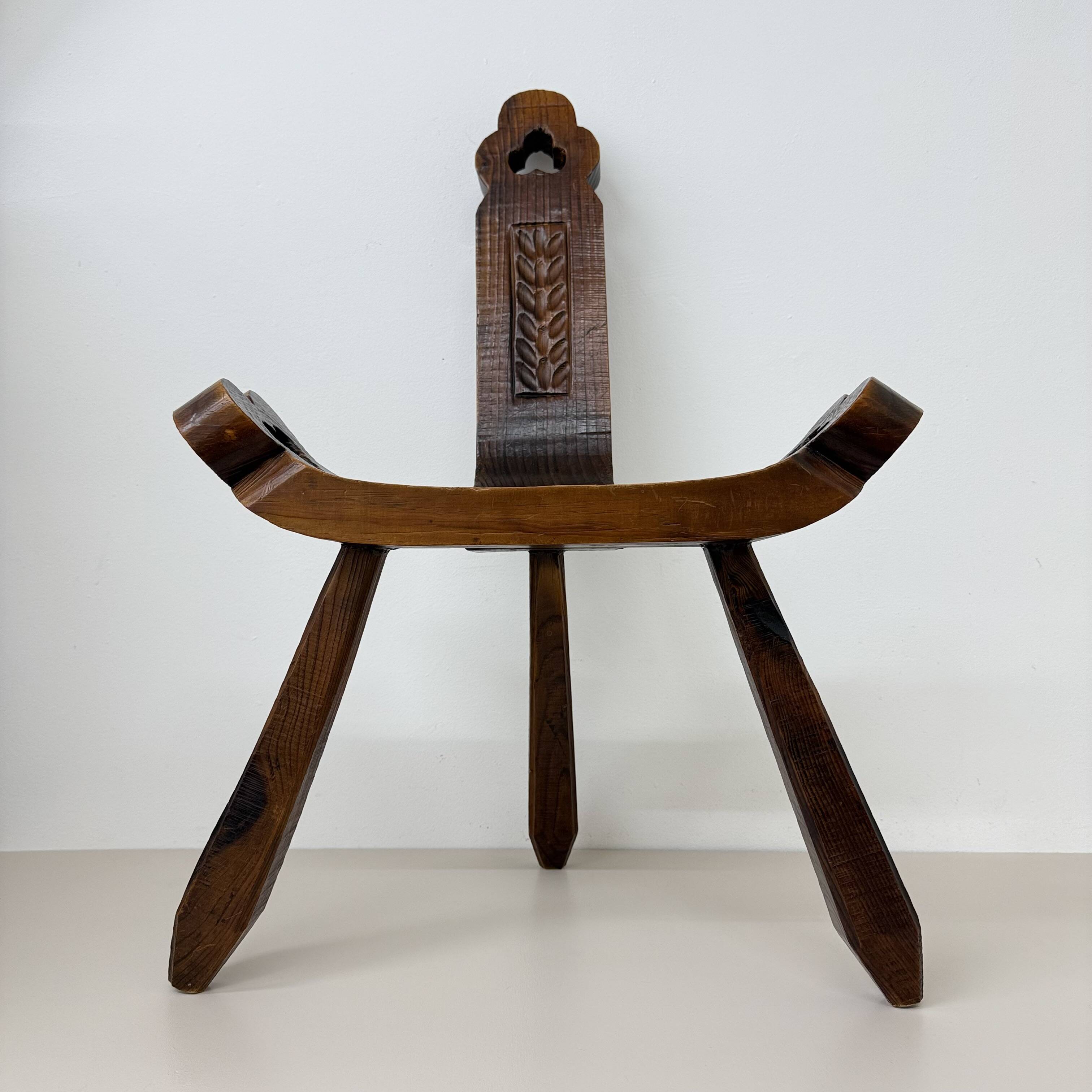 Brutalist hand carved oak Spanish tripod chair , 1970s