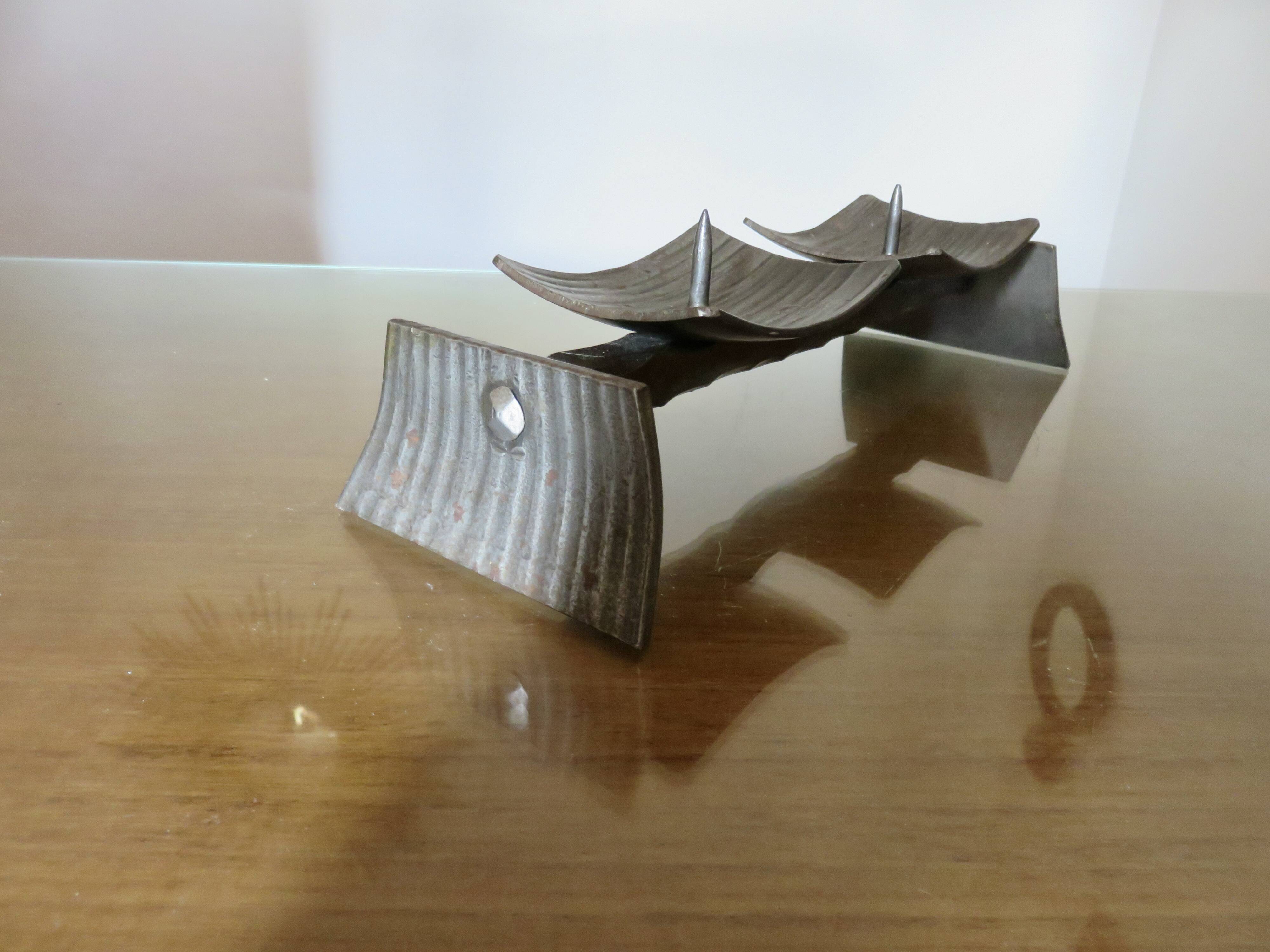 Large brutalist candlestick in the style of the Marolles workshops, raw steel.