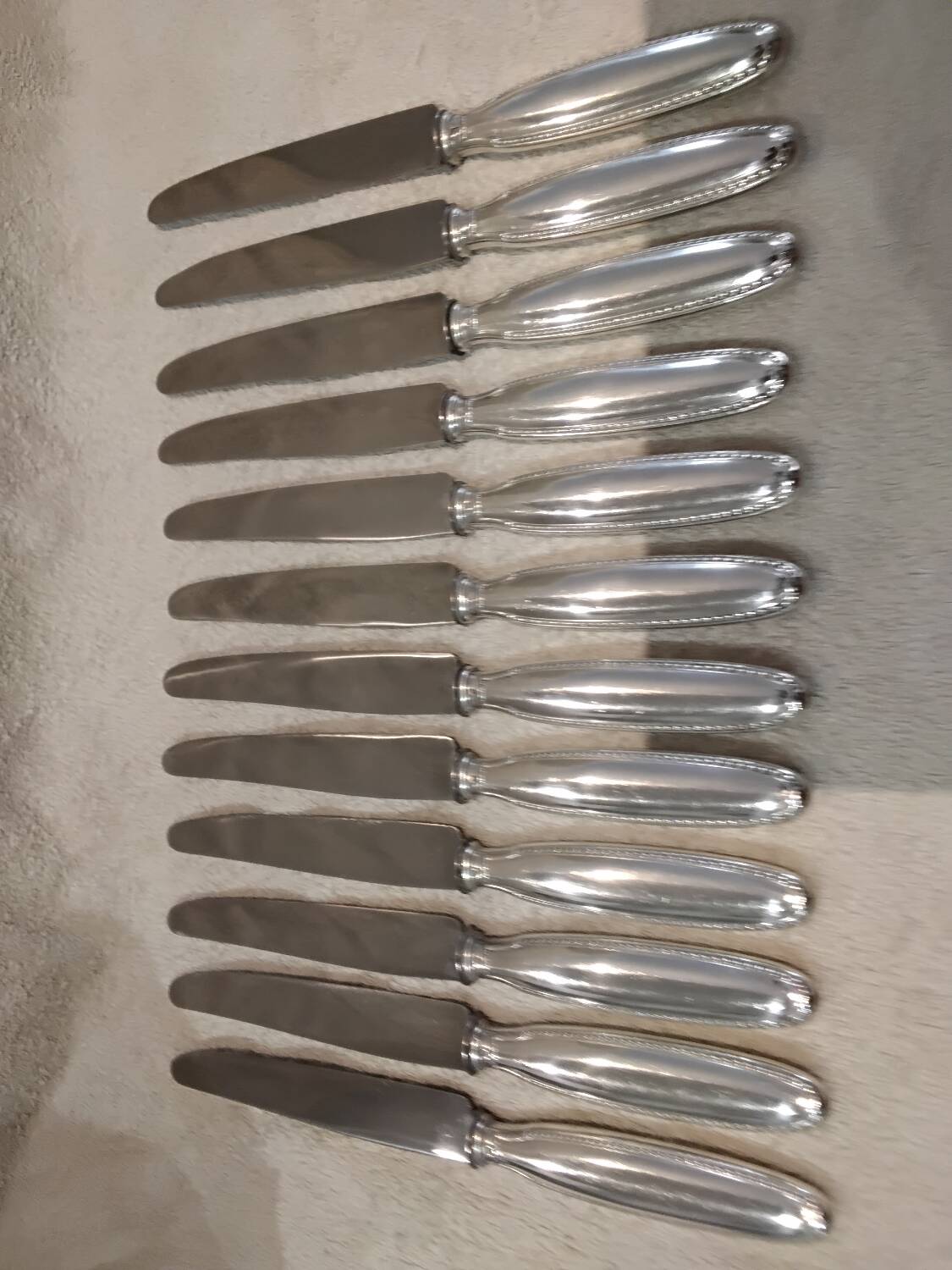 12 silver plated table knives, goldsmith Alfenide st LXVI pearls
