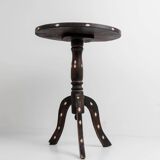 Vintage side table from the early 19th century, dark wood with mother-of-pearl inlays, oval shape with three legs, ethnic style.