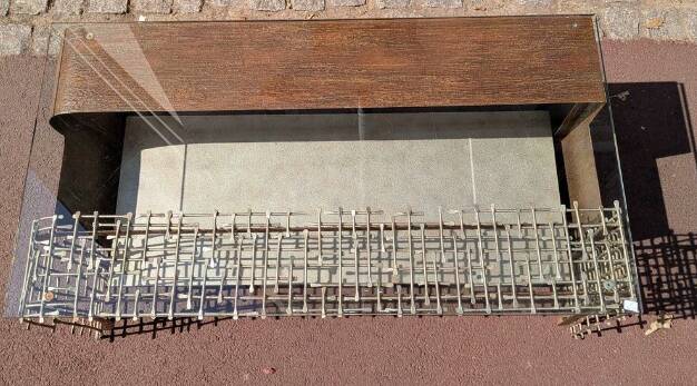Metal coffee table with a glass top.