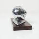 Silver snail candlestick on a teak base 1960