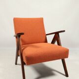Vintage orange curly armchair Scandinavian design 1970