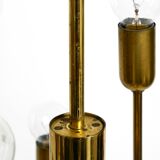 Three staged 18 arm Mid Century brass chandelier with a long brass rod