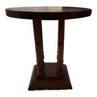 1930s Art Deco round side table in brown wood — circular top and turned legs.