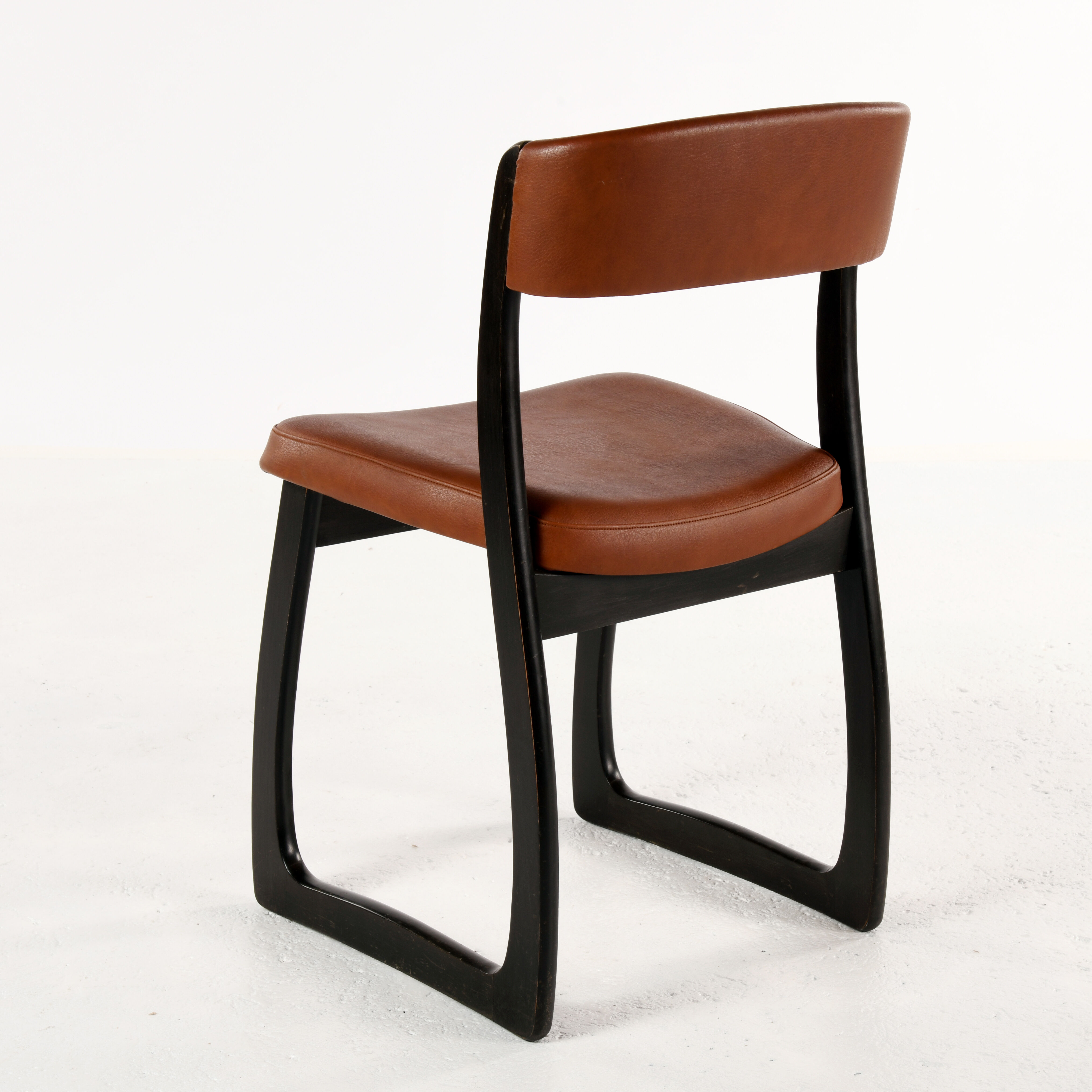 Set of 4 vintage wood and skai sled chairs