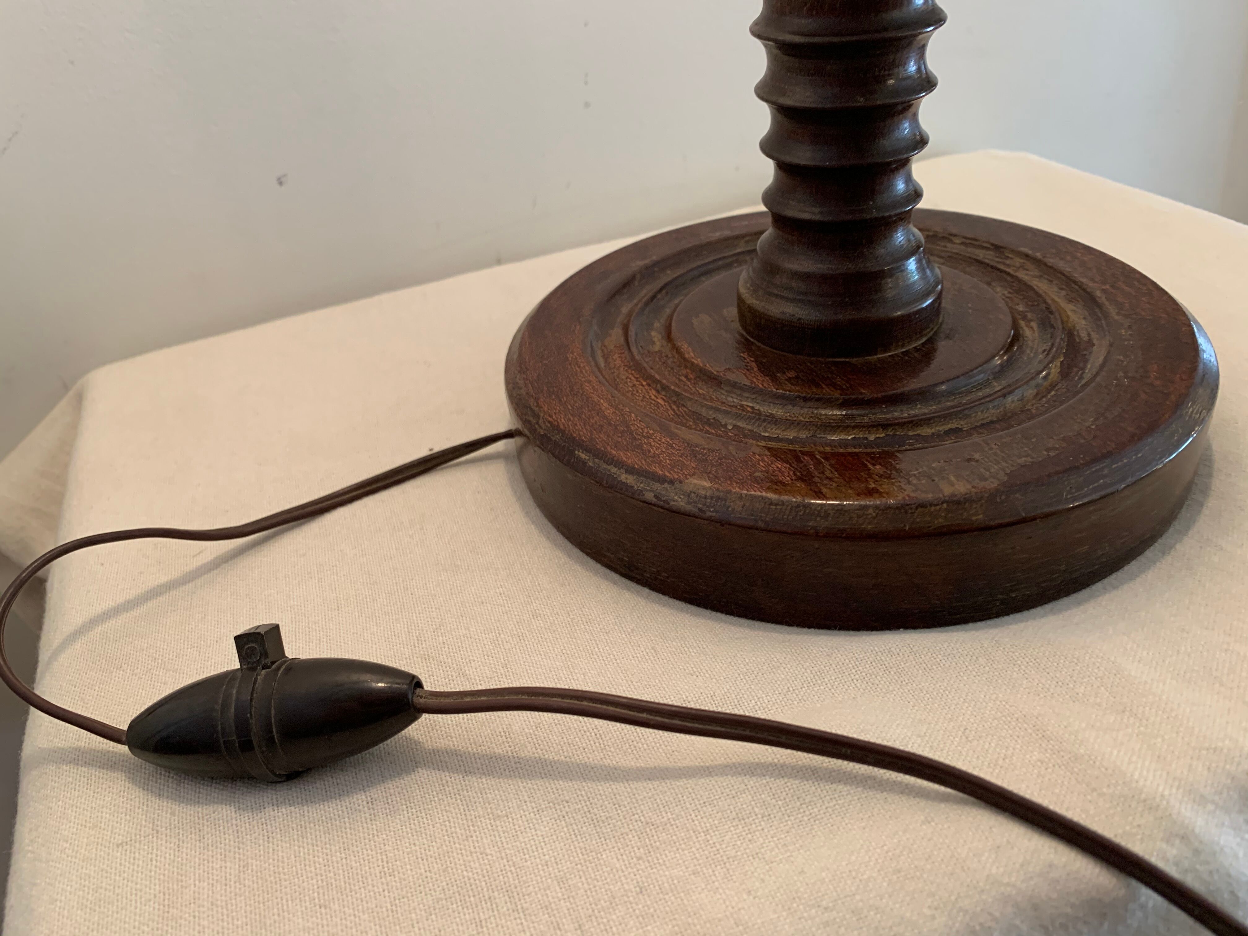 Turned wooden lamp foot in the shape of a warhead