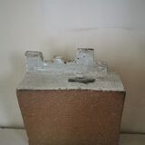 Vase architecture in raw sandstone.