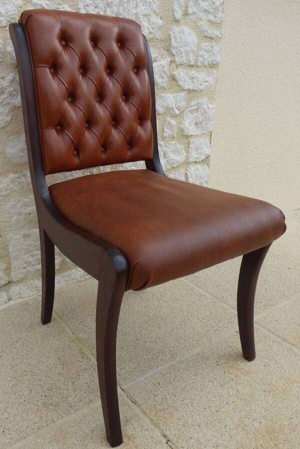 Chic Vintage Chesterfield style chair with wooden frame and faux leather