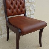 Chic Vintage Chesterfield style chair with wooden frame and faux leather