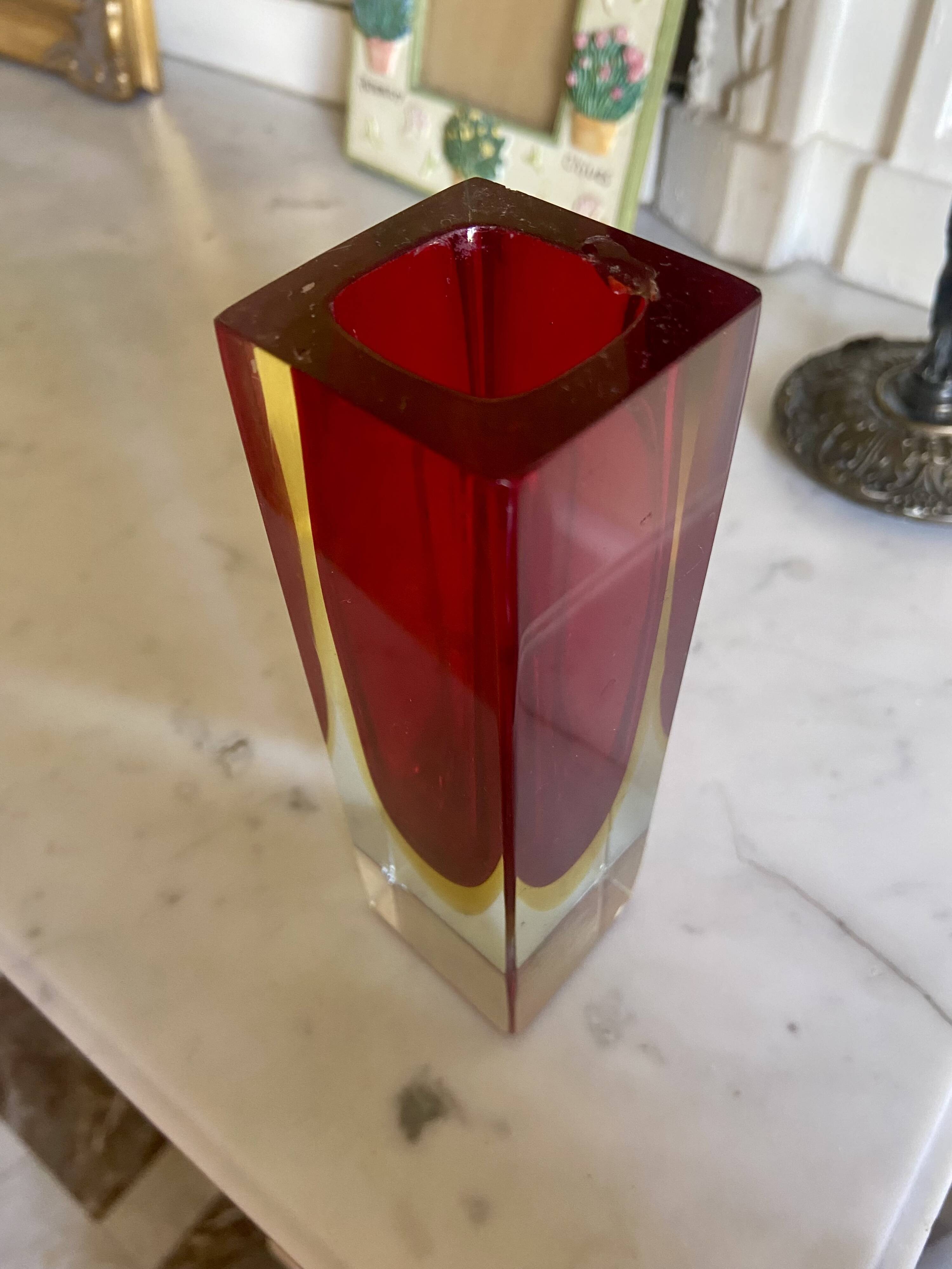 Small red vase made of Murano glass.