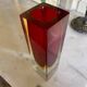 Small red vase made of Murano glass.