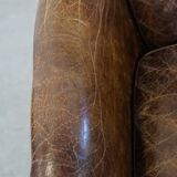 Grained cowhide armchair with a timeless design