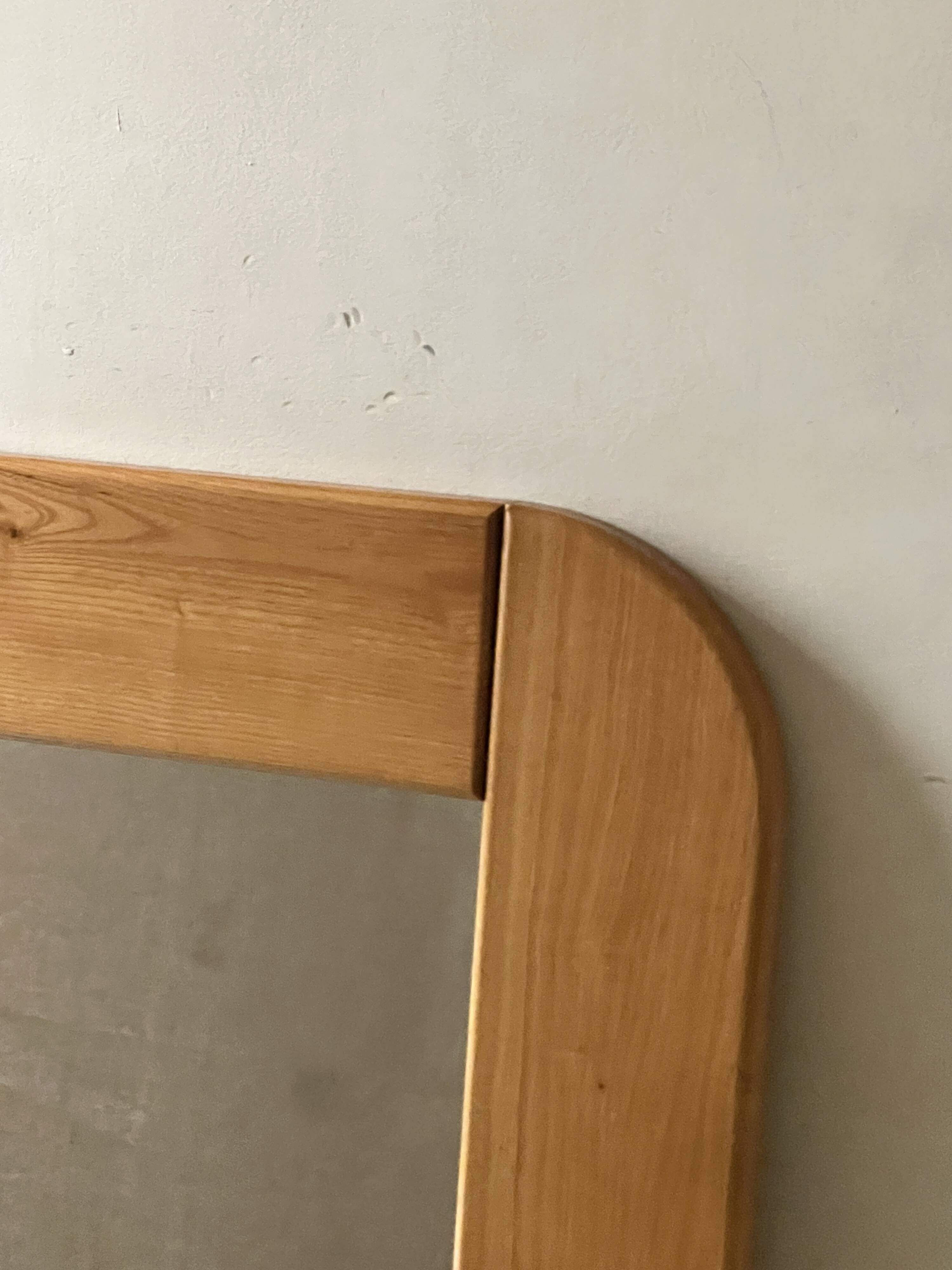 Large oak mirror in the style of a revival house, 1970s design.