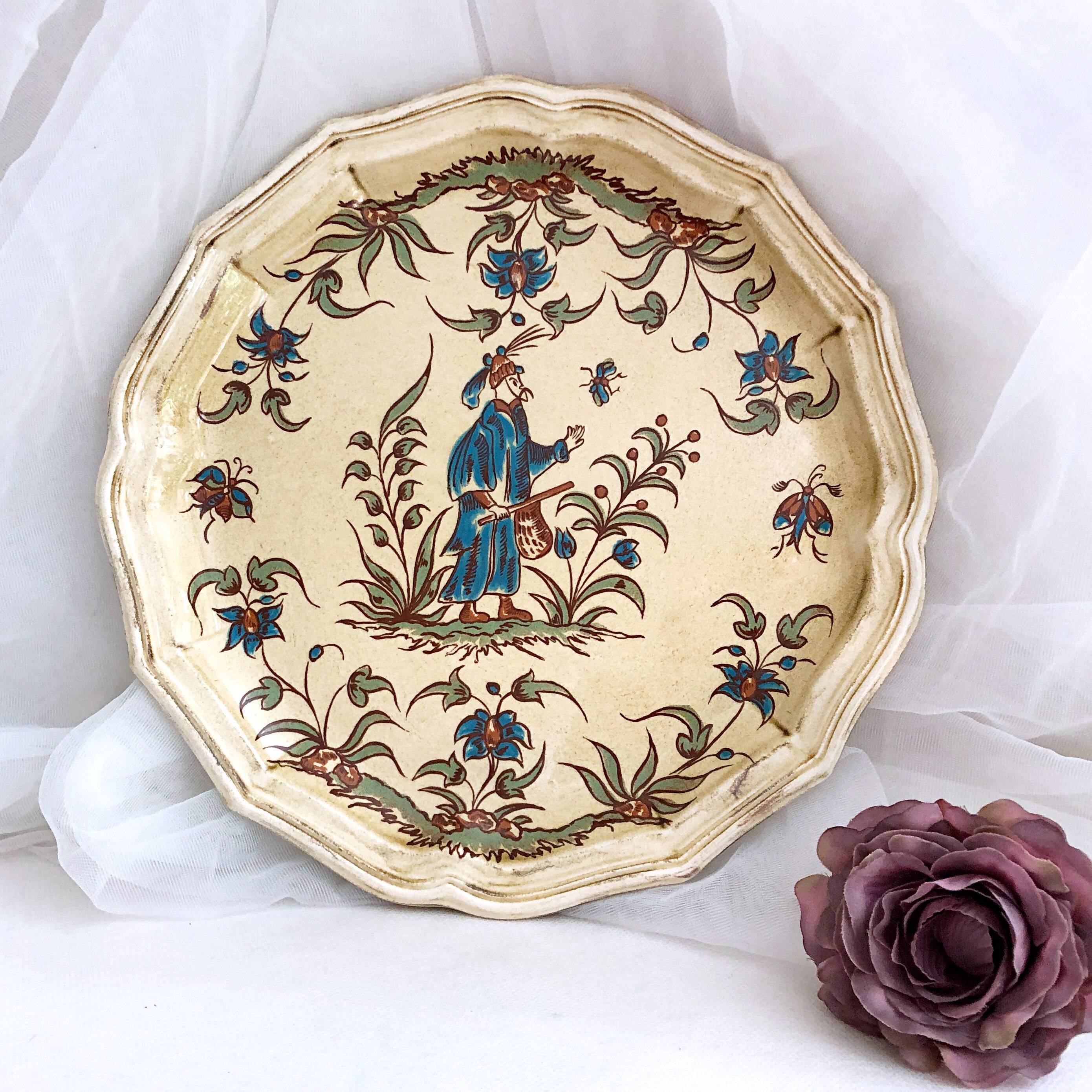 Decorative earthenware plate from Salins France, Moustiers decor, 25.5 cm