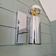 Pair of tubular chrome-plated metal wall sconces, 1970s