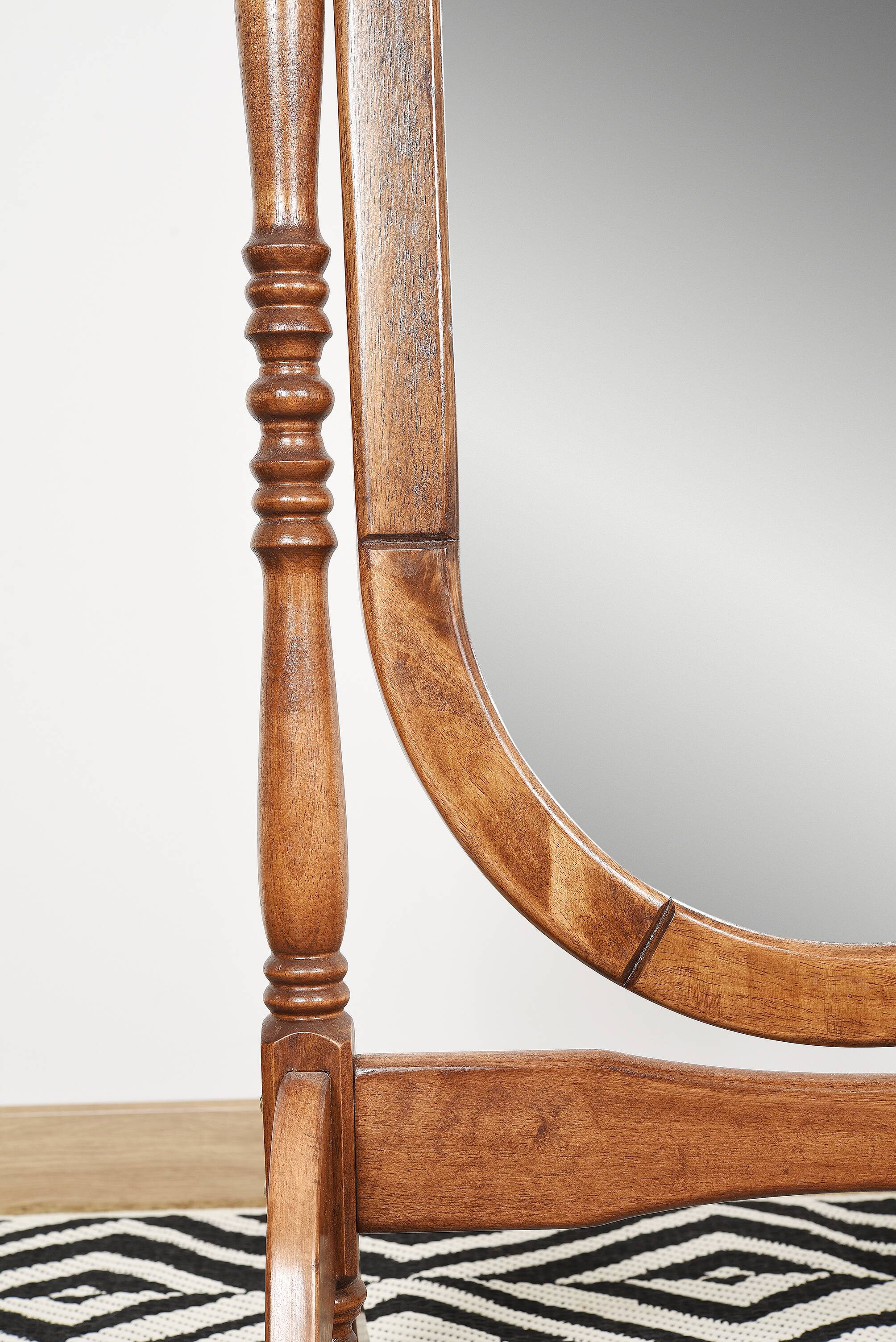 Large psychic mirror on legs with pivoting oval frame.