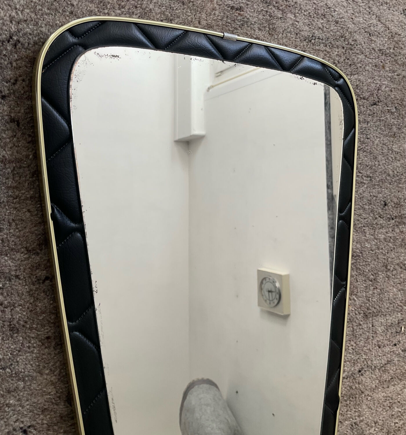 Asymmetrical mirror from the 1960s.