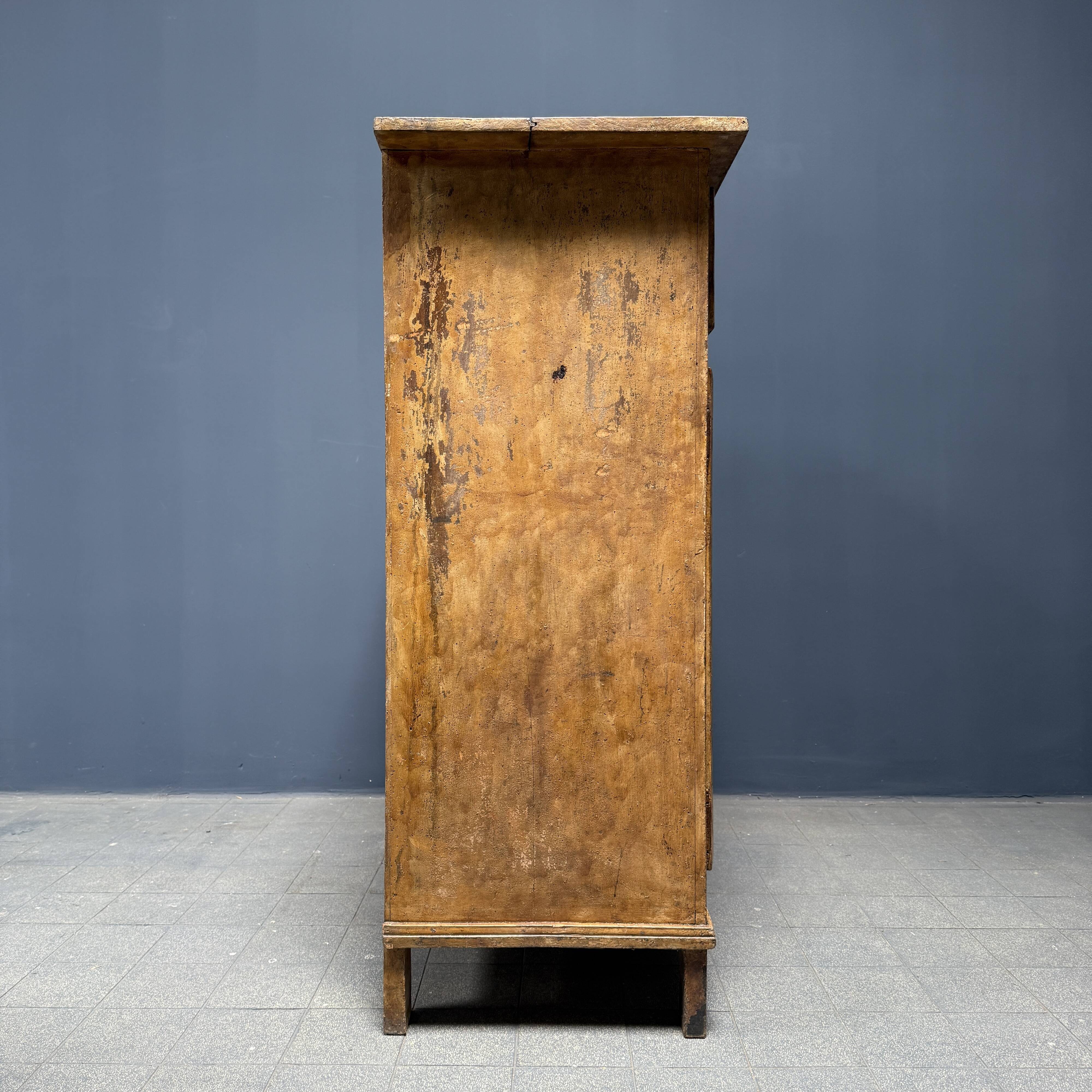 Old marbled ochre yellow French farmhouse cabinet