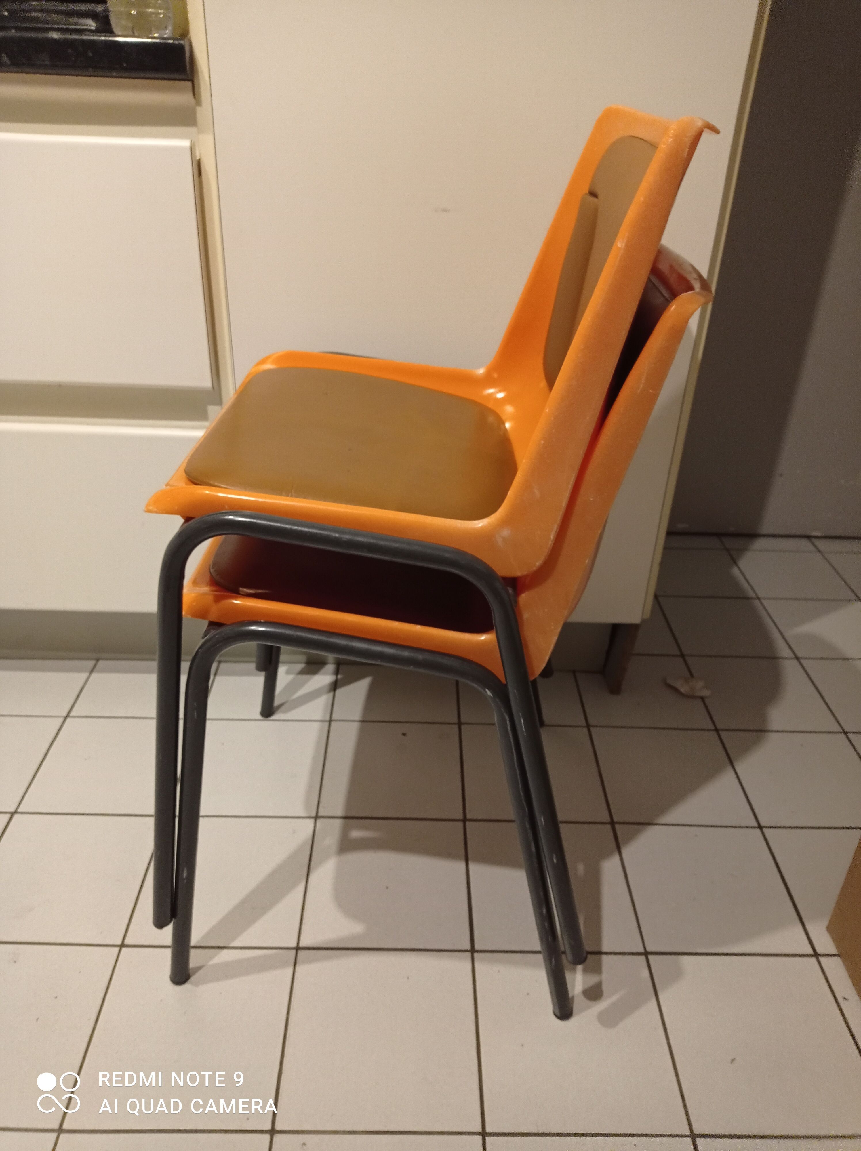 Chairs orange plastic shells seats and backrests imitation leather