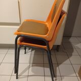 Chairs orange plastic shells seats and backrests imitation leather