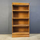 Four tier oak barrister style bookcase with leaded glass