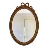 Golden oval mirror with knot