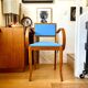 Bridge armchair in wood and blue skaï