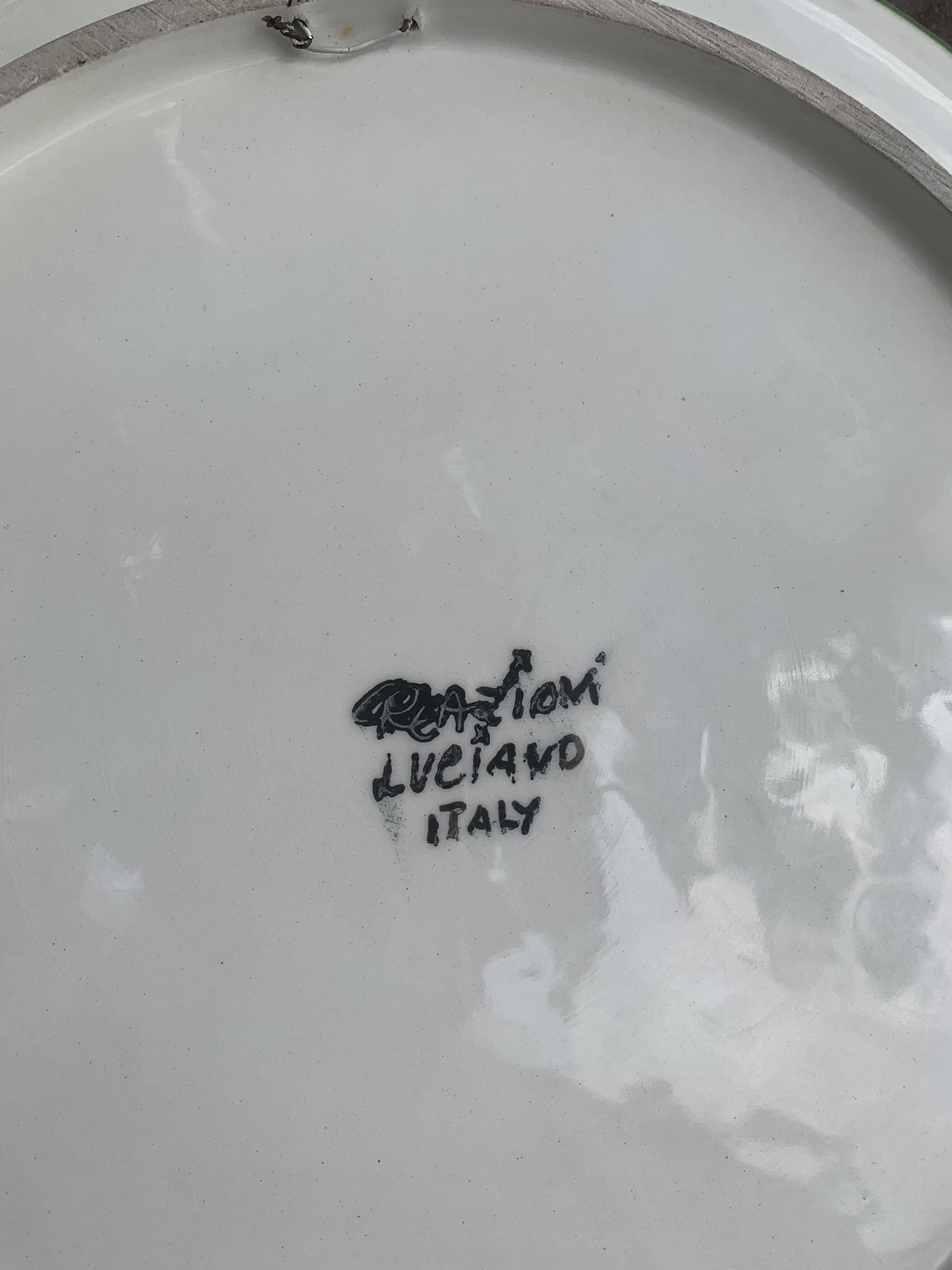 Decorative plate to hang, fruit model, in enamelled ceramic, Les Fruits, signed Luciano