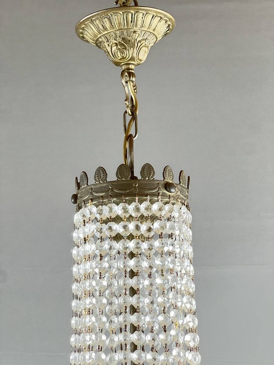 Empire-style chandelier in bronze with crystal pendants, early 20th century.