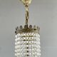 Empire-style chandelier in bronze with crystal pendants, early 20th century.