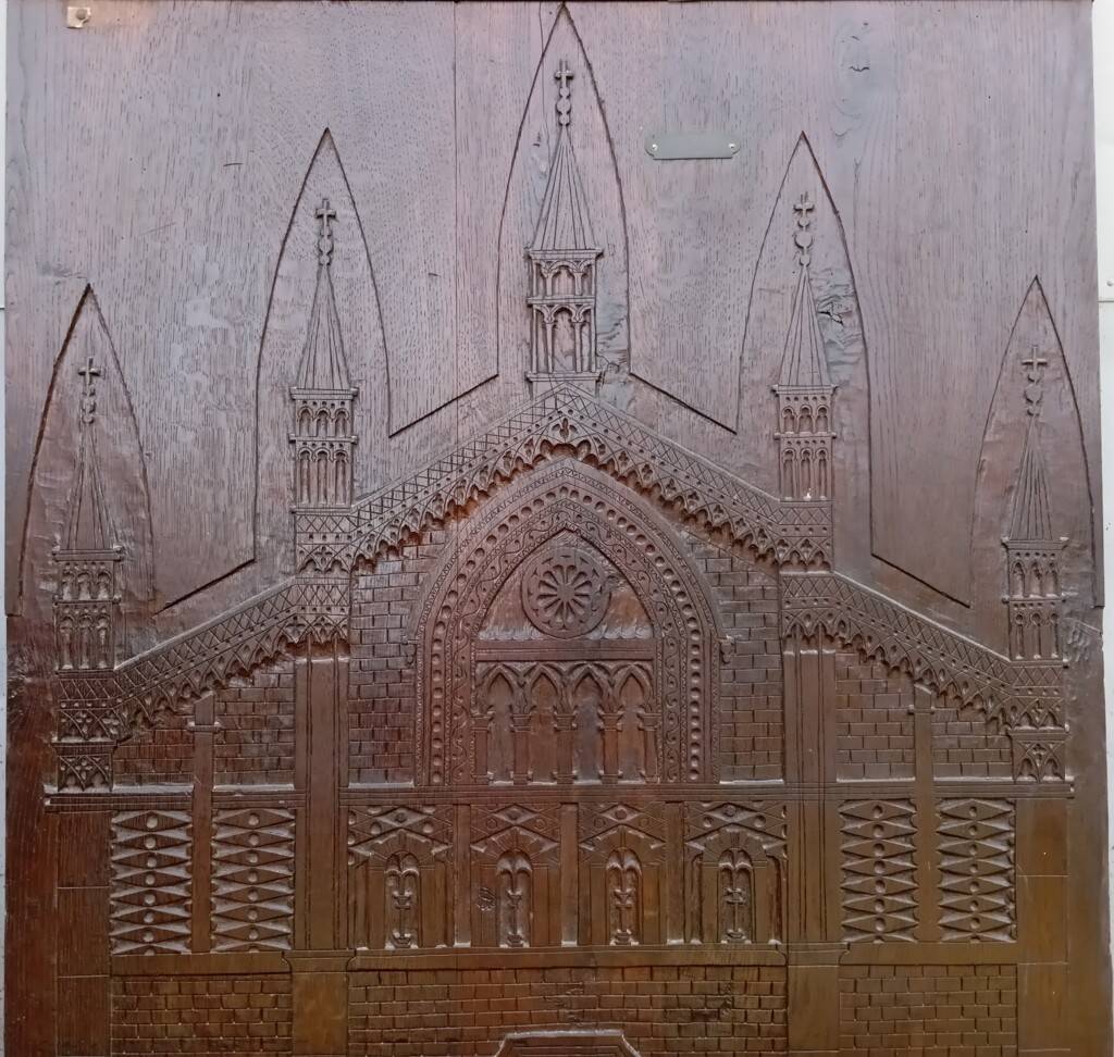 Large sculpted panel façade cathedral Pavia