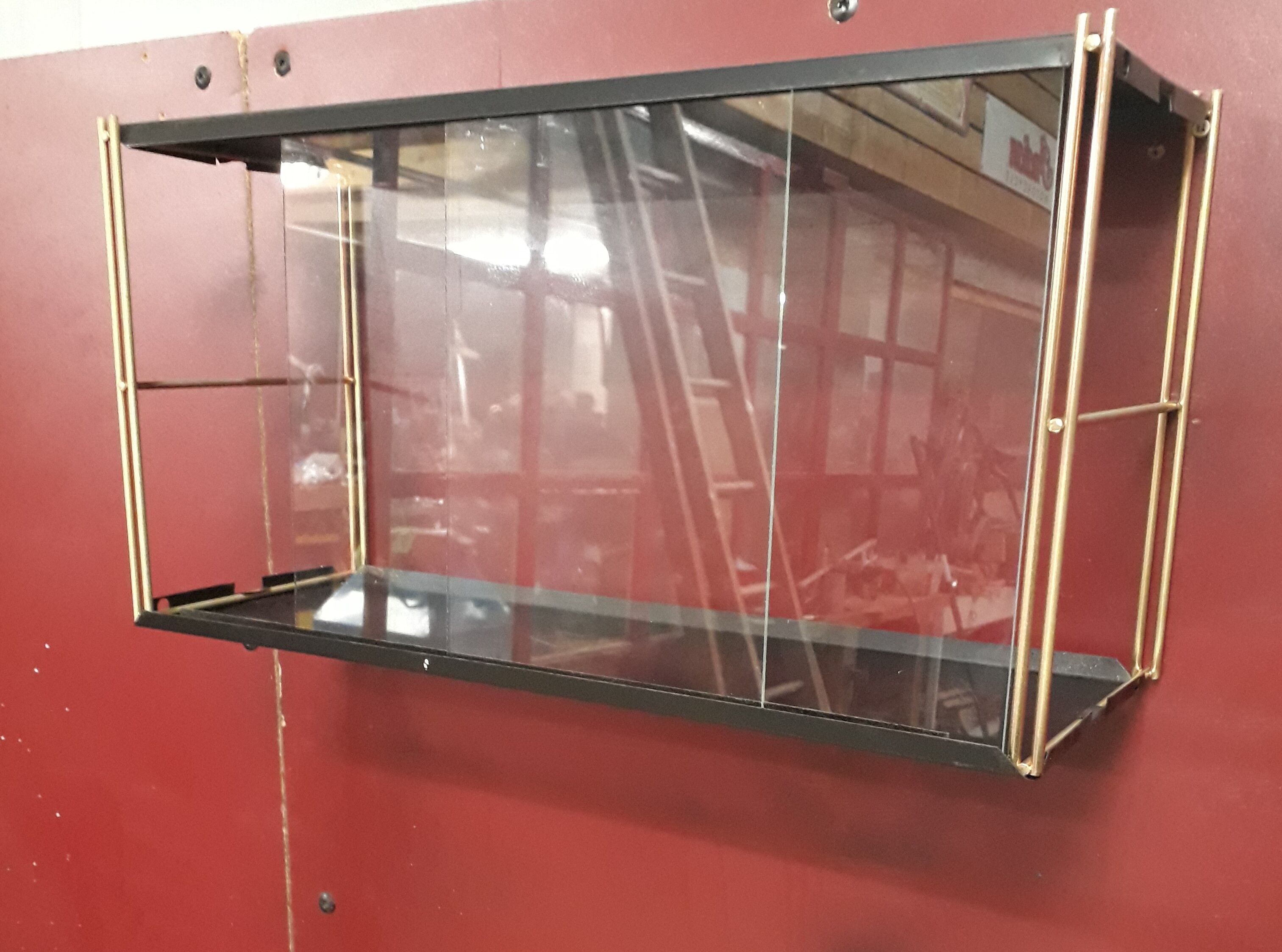 Wall-mounted Tomado showcase 1960