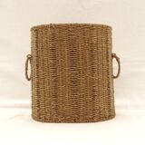 Braided straw wastepaper basket.
