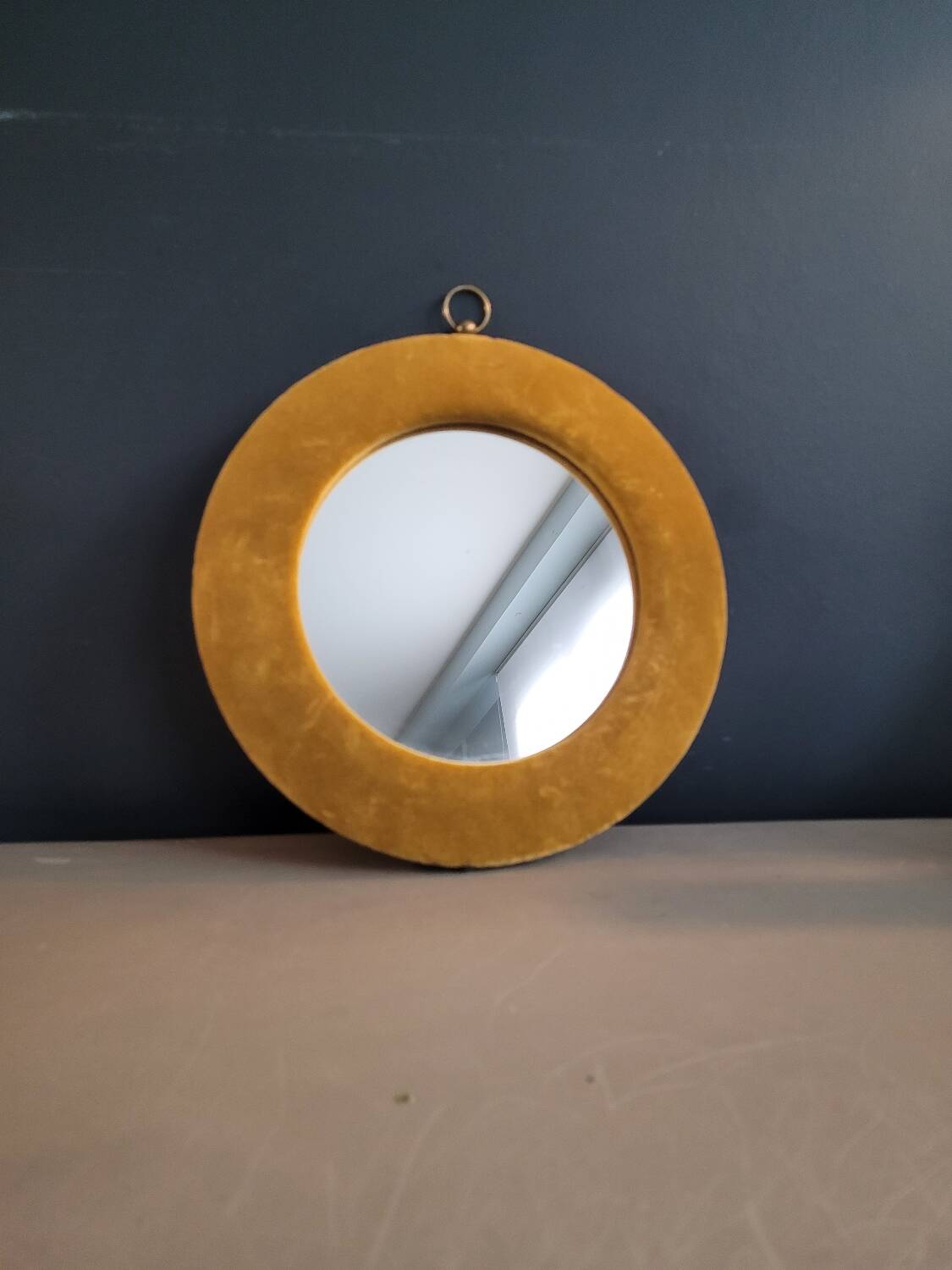 Vintage mirror with mustard velvet frame