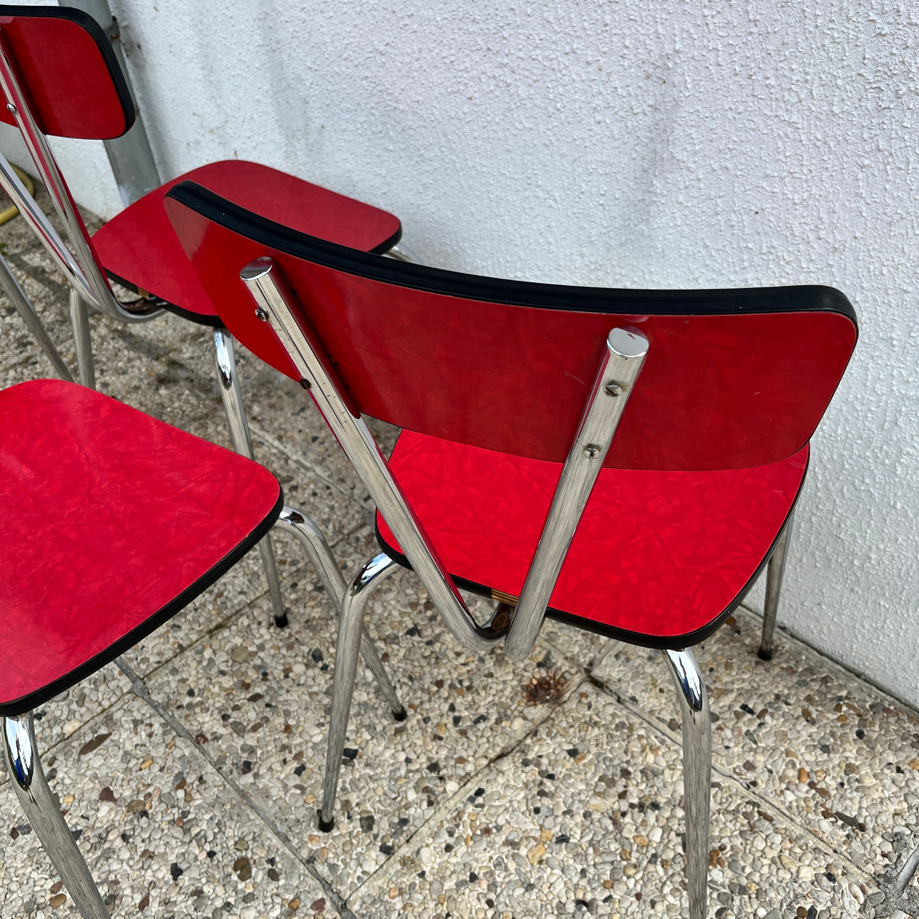 Chairs in formica red foot compass