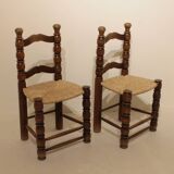 Pair of rustic chairs in turned wood with straw seats
