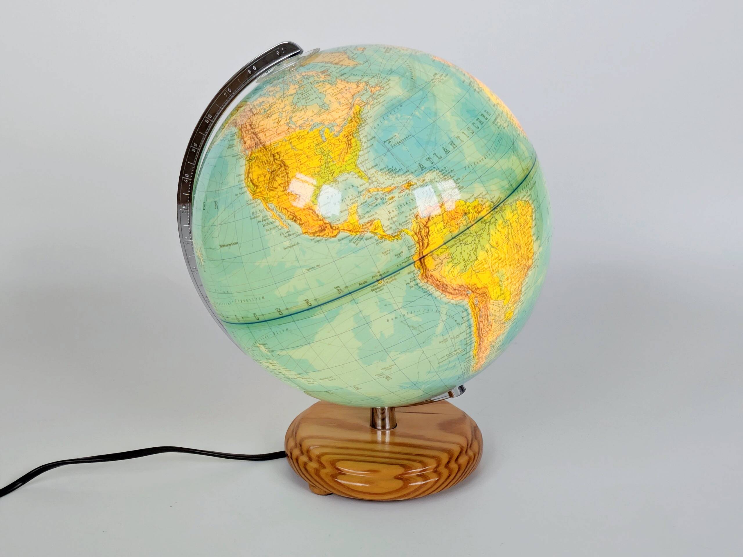Columbus Duplex illuminated globe on a wooden base, 1980s