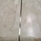 Coffee table in mosaic travertine and brass 70