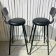 Pair of black bar stools in industrial and contemporary style.
