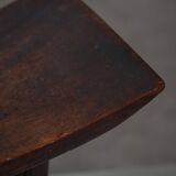 Sculptural African stool in hardwood, curved seat and architectural base, 1970s.