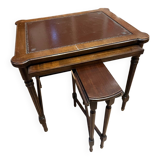 Classic nesting tables in wood and leather.