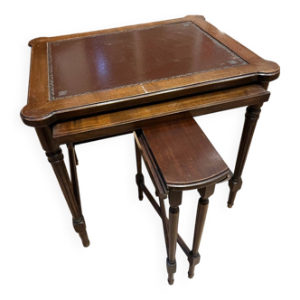 Classic nesting tables in wood and leather.