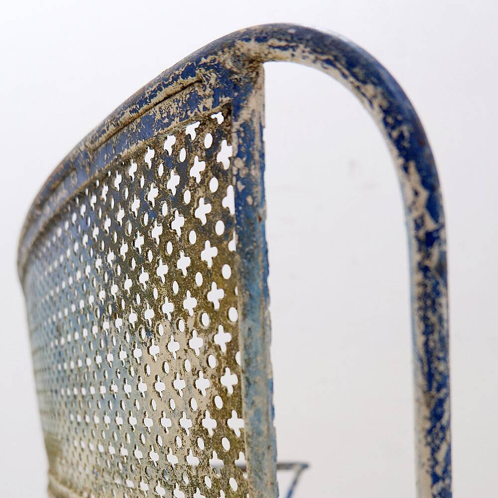 Vintage perforated metal armchair from the 1950s.