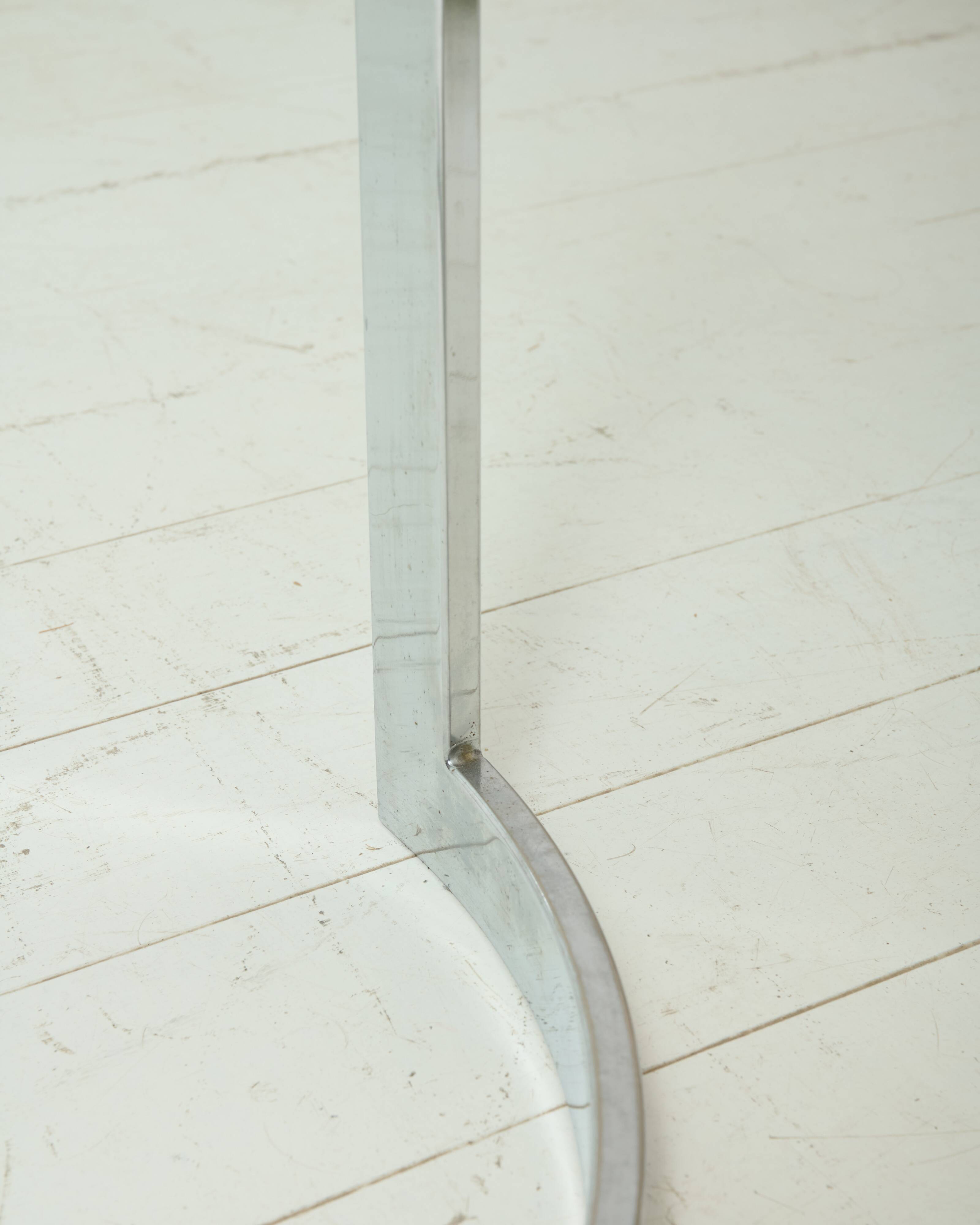 Dining table with a circular base.