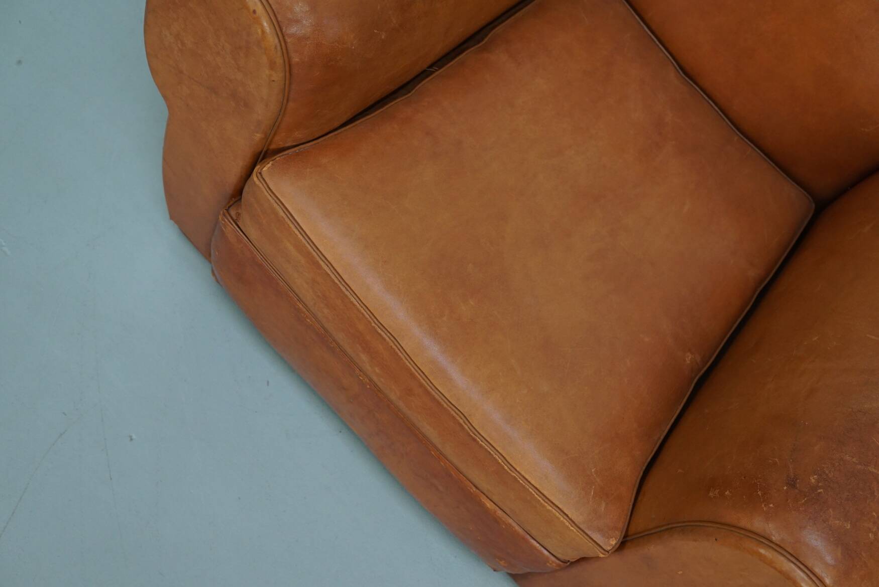Pair of French club chairs with moustache back in cognac leather, 1950s