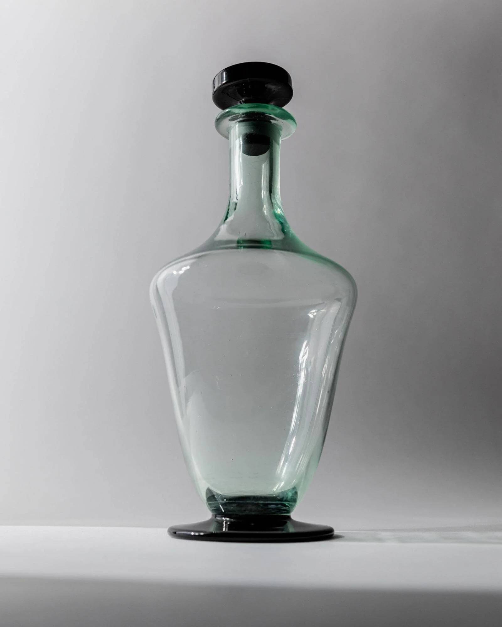 Vintage Murano glass carafe from the 1960s, green and black, with a stopper.