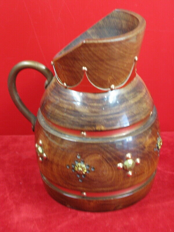 Wooden pitcher and vintage copper decoration