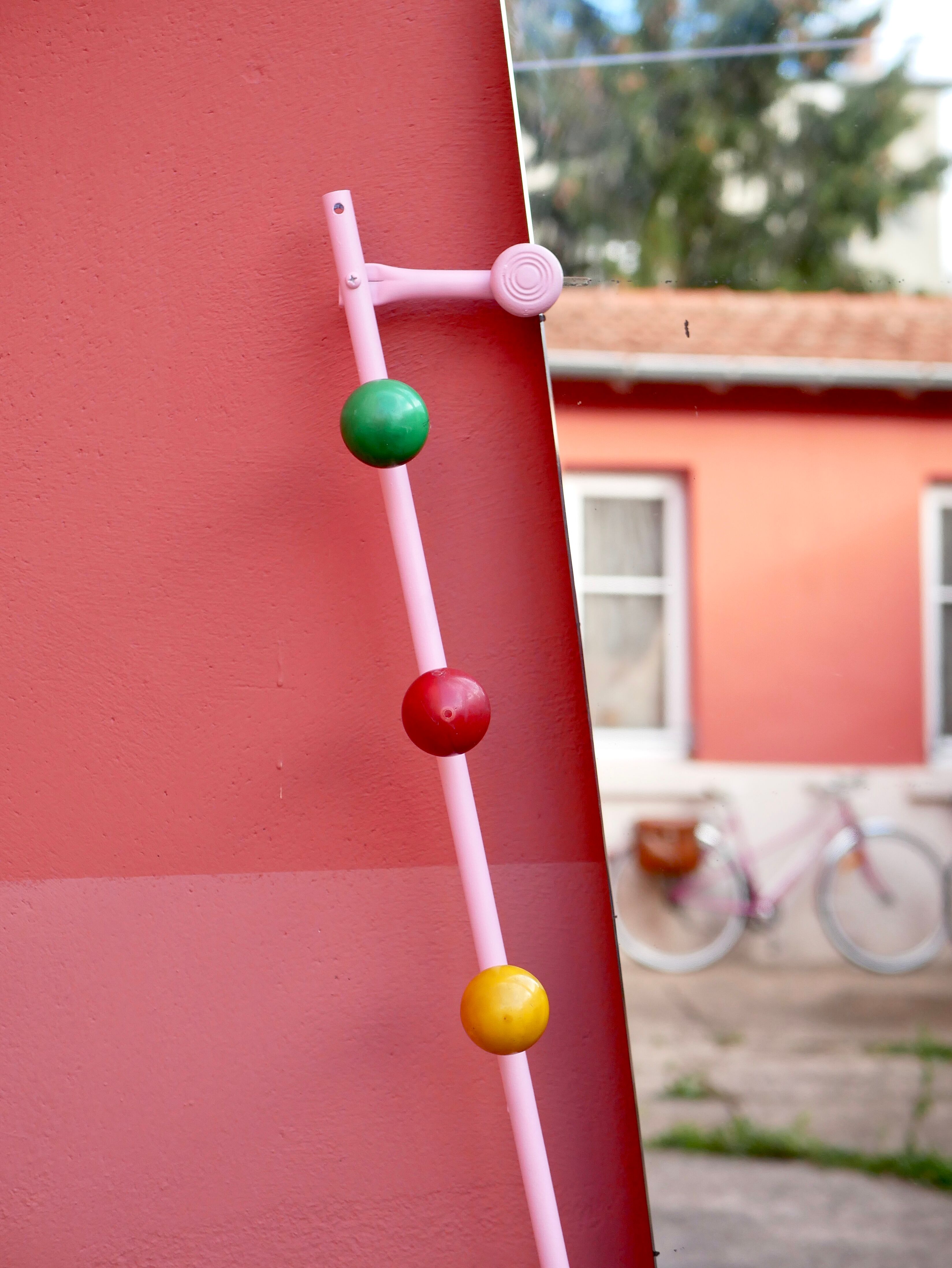 Standing coat rack with mirror, colored balls