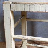 Old patinated painted wooden stool